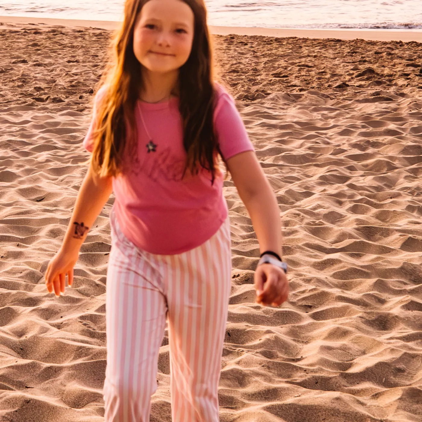 Rosie Ice on the beach at sunset in Maui