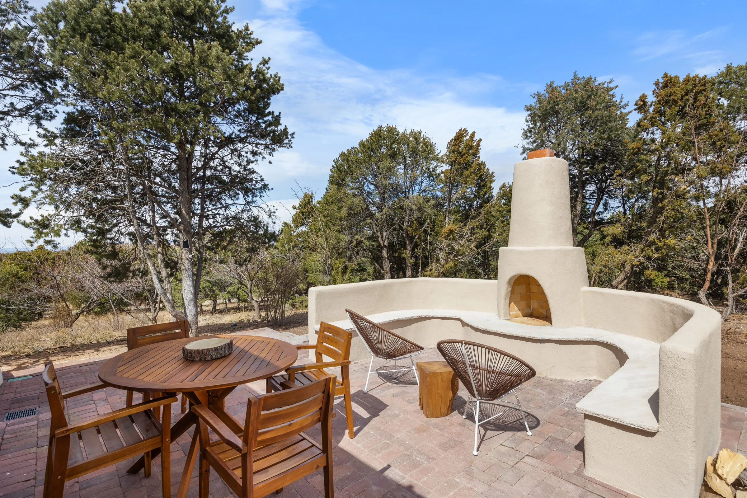 Casa de Ice, the family's adobe estate at golden hour outside Santa Fe