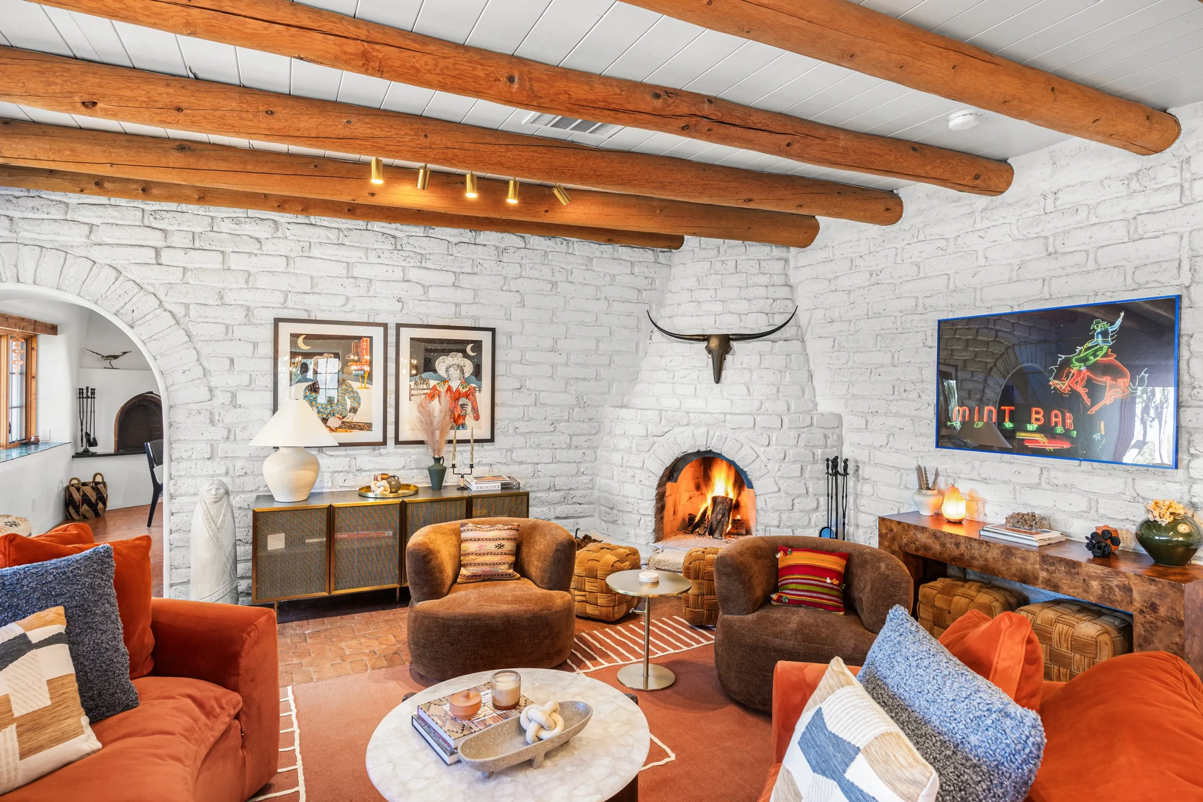 The great room at Casa de Ice — kiva fireplace and viga ceiling