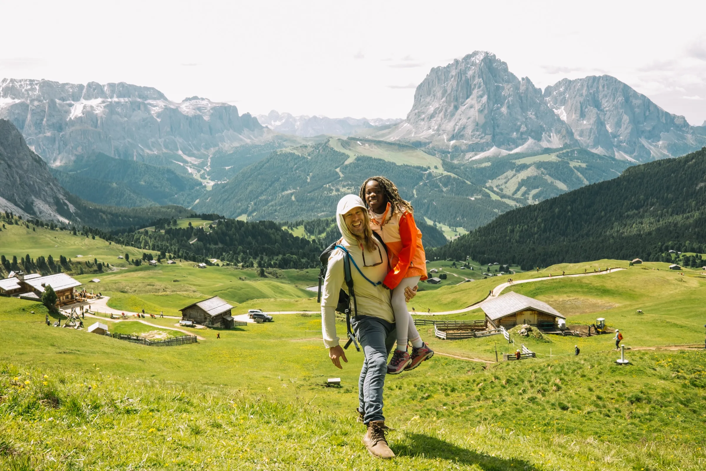 Jamey carrying a daughter on the Seceda ridge, the Dolomites