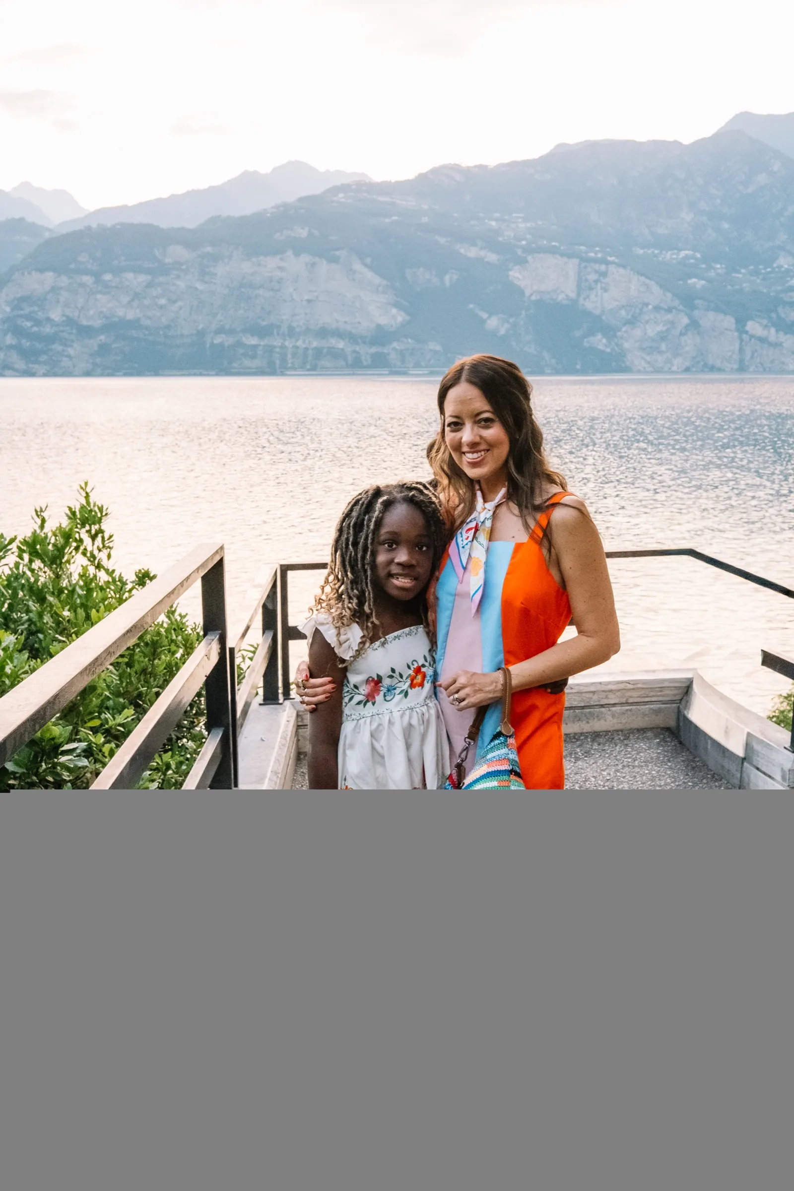 Melissa and Justice on a hotel terrace over Lake Garda