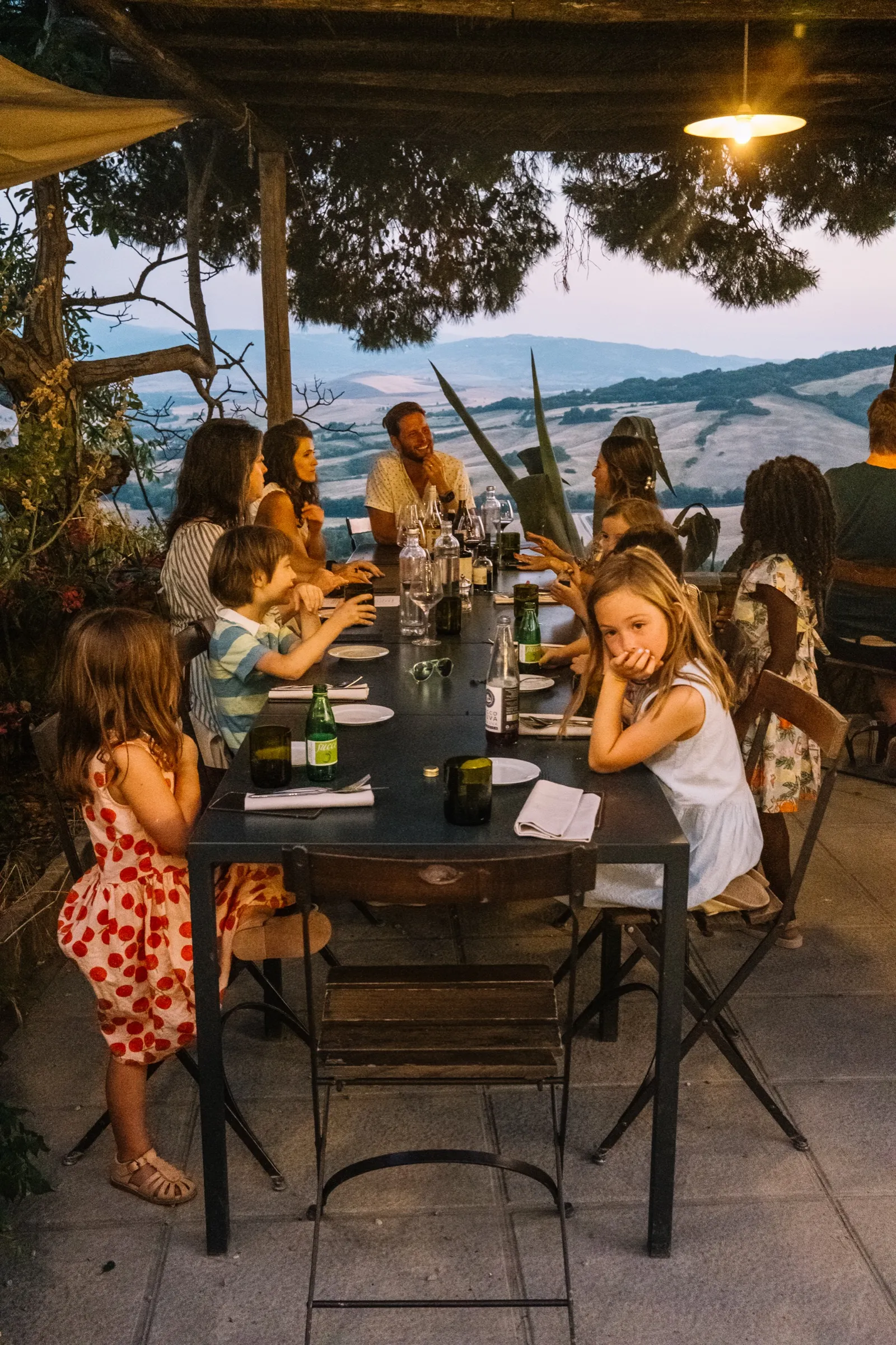 The Ice family at a table on a trip