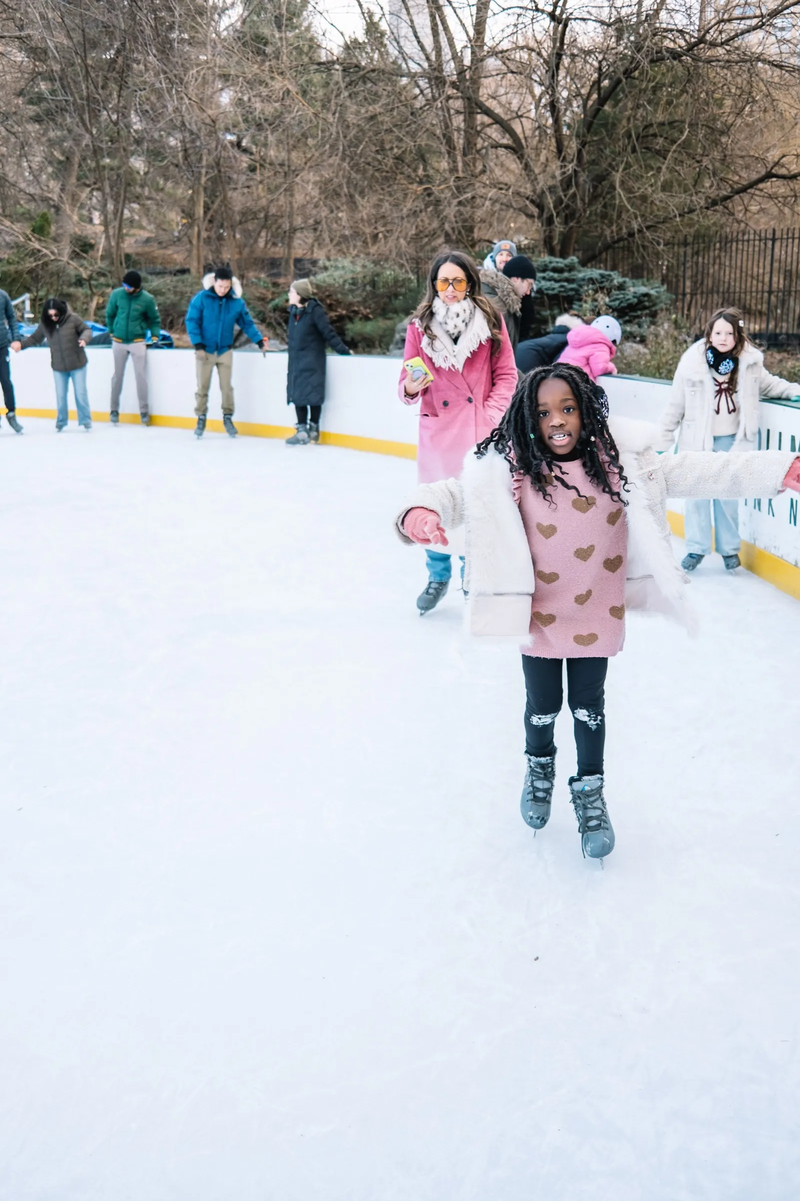 A girl skating at Wollman Rink in Central Park in winter