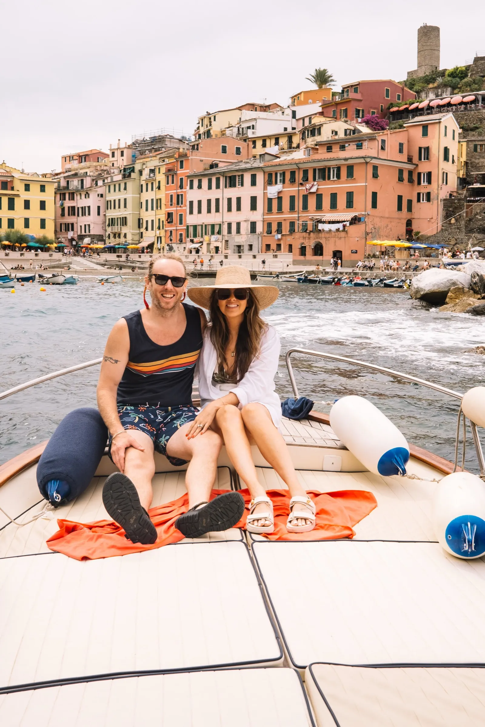 The Ice family on the wooden deck of a tour boat off the Cinque Terre coast, kids in life vests